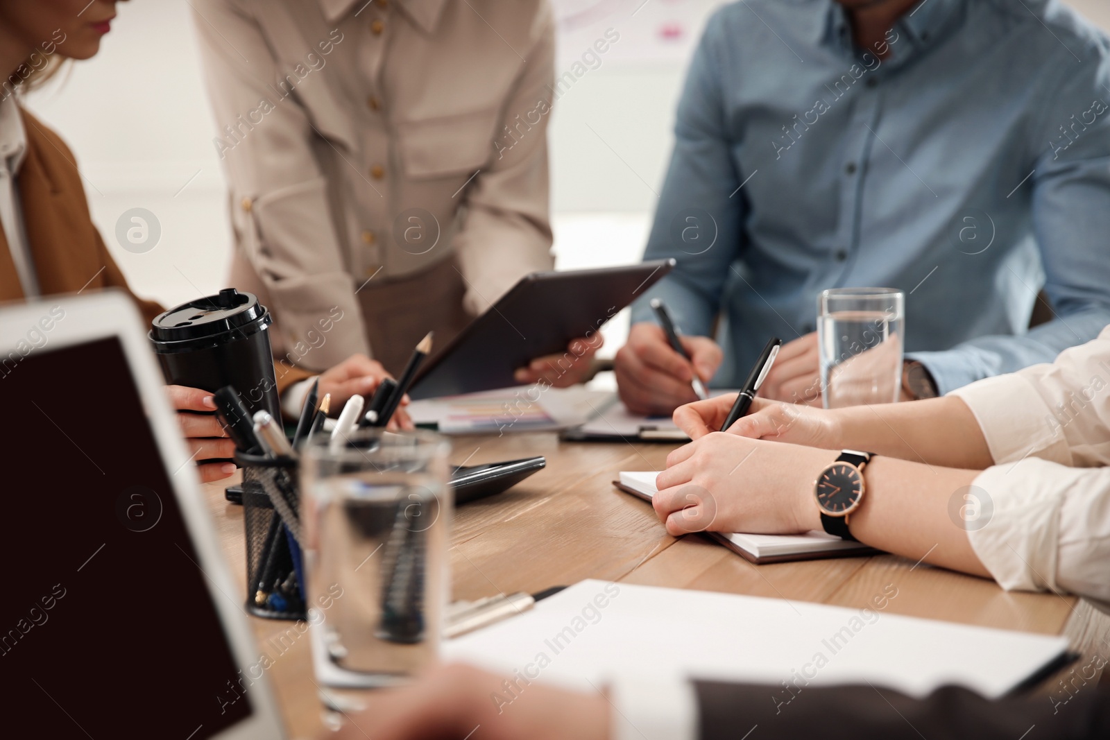 Photo of Businesspeople having meeting in office, closeup. Management consulting