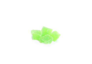 Photo of Delicious green candied fruit pieces on white background