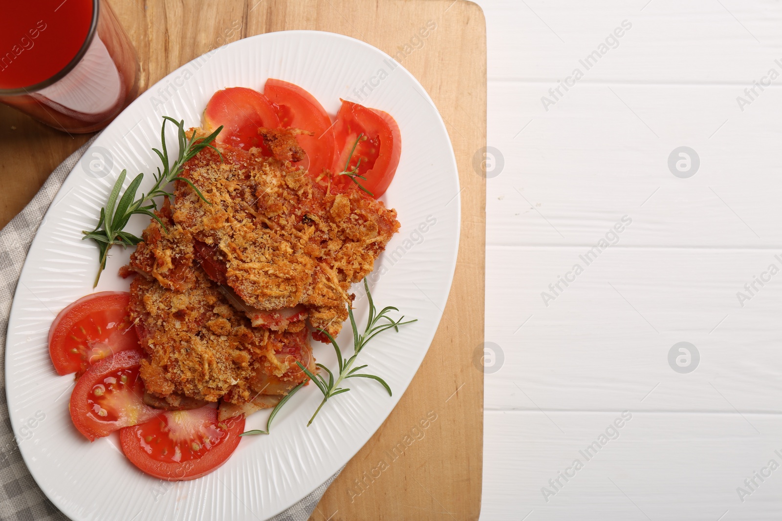 Photo of Tasty fried parsnips with fresh tomatoes and rosemary on white wooden table, top view. Space for text