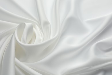 Photo of Texture of crumpled white silk fabric as background, closeup