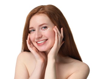 Smiling woman with freckles and cream on her face against white background