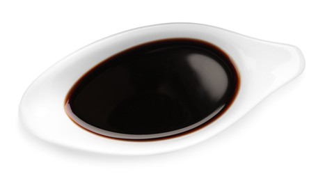 Photo of Bowl of soy sauce isolated on white, top view