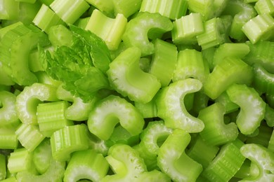 Fresh green cut celery as background, closeup