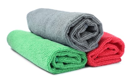 Photo of Many colorful microfiber cloths on white background