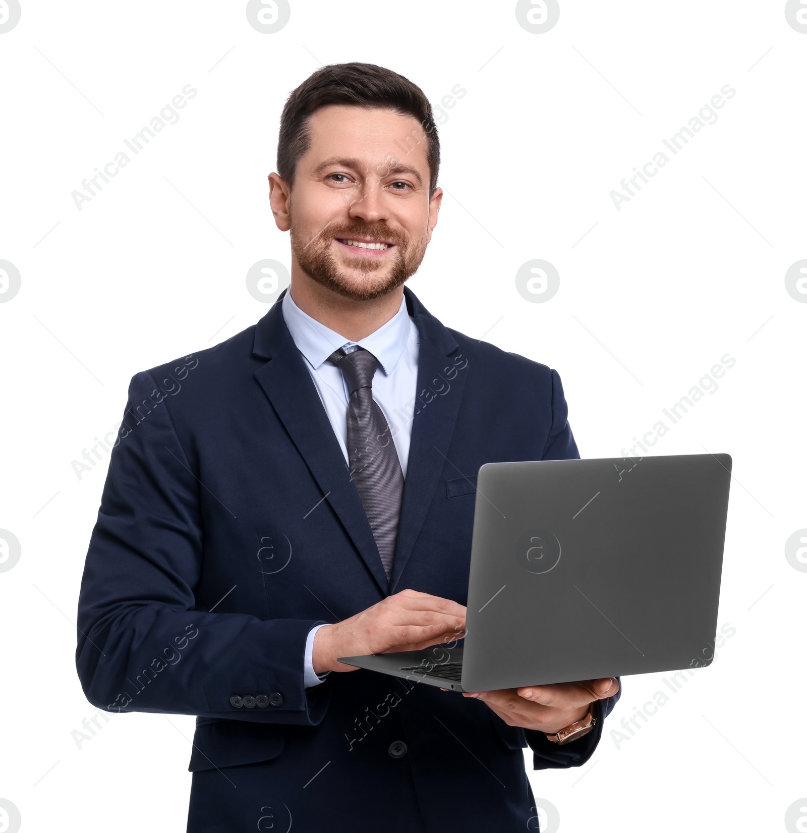 Photo of Handsome bearded businessman in suit with laptop on white background