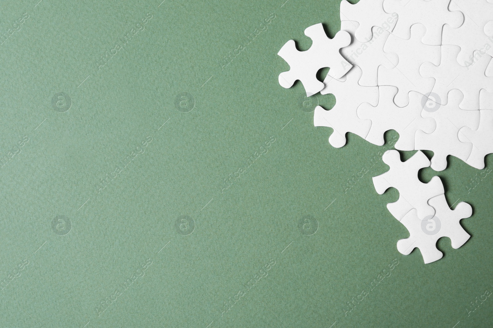 Photo of Blank white puzzle pieces on grey background, flat lay. Space for text