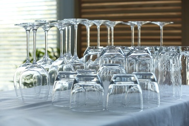 Photo of Set of empty glasses on table indoors