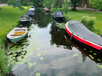 Beautiful view of moored boats in canal on sunny day