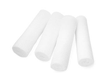 Photo of Many medical bandage rolls on white background