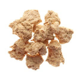 Dehydrated soy meat chunks on white background, top view