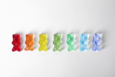 Photo of Delicious jelly bears on white background, top view