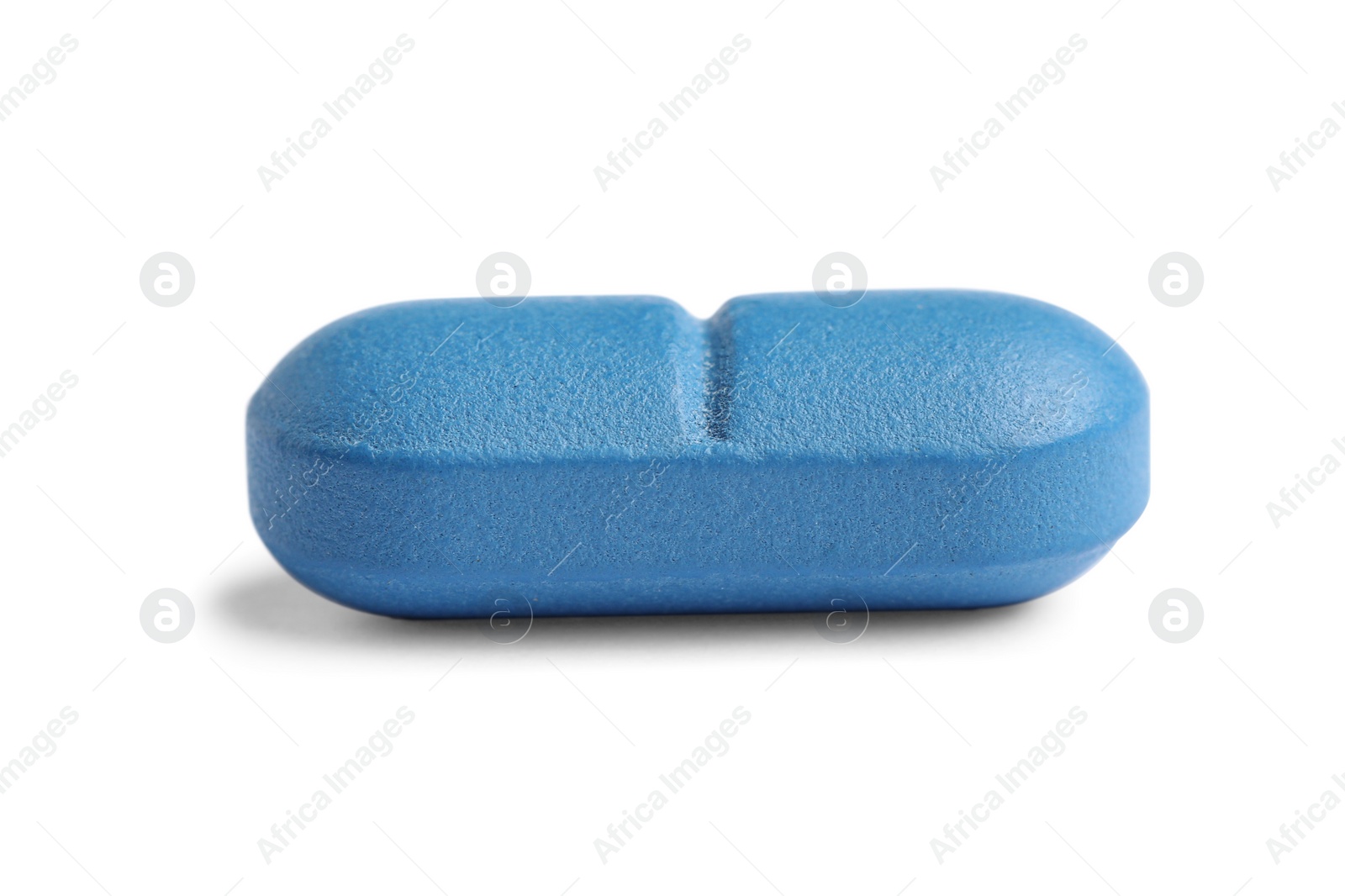 Photo of One blue pill on white background. Medicinal treatment