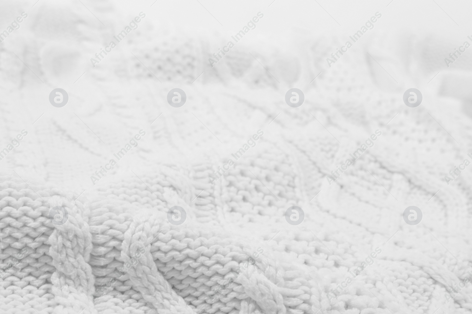 Photo of Texture of cozy warm sweater as background, closeup