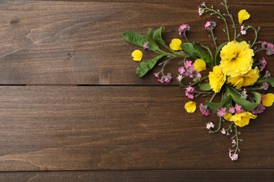 Photo of Beautiful composition with forget-me-not flowers on wooden table, flat lay. Space for text