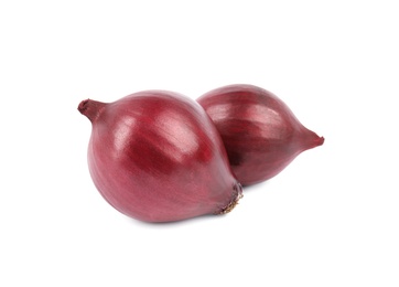 Photo of Fresh whole red onions on white background