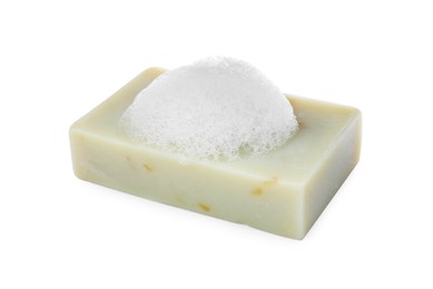 Photo of Soap bar with fluffy foam on white background