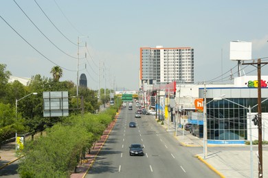 Photo of SAN PEDRO GARZA GARCIA, MEXICO - AUGUST 29, 2022: Cars in traffic jam on city street, aerial view