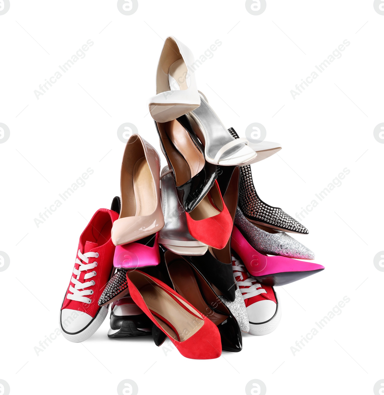 Photo of Pile of different female shoes isolated on white