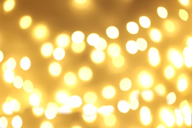 Photo of Beautiful golden lights as background. Bokeh effect