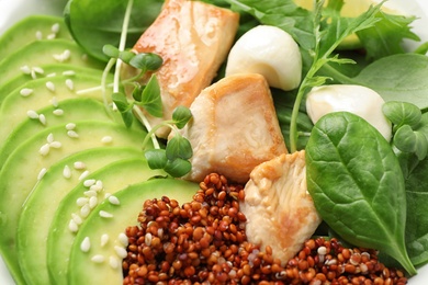 Photo of Delicious avocado salad with chicken in bowl, closeup