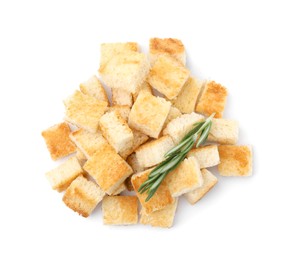 Delicious crispy croutons with rosemary on white background, top view