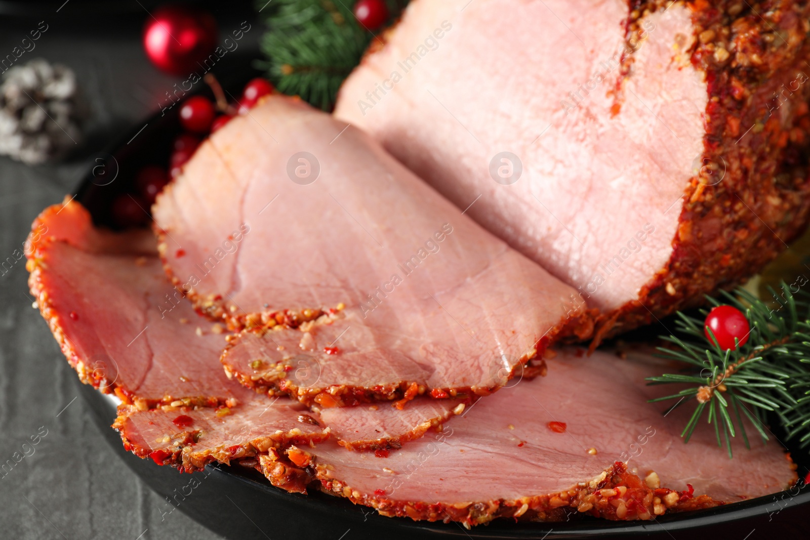 Photo of Tray with delicious ham on table, closeup. Christmas dinner