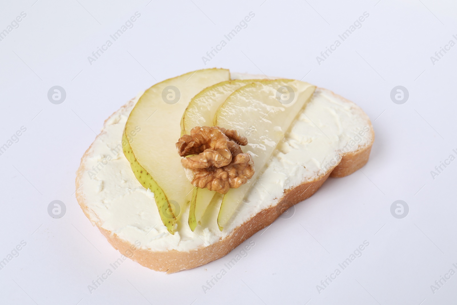 Photo of Delicious bruschetta with ricotta cheese, pears and walnut on white background