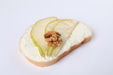 Photo of Delicious bruschetta with ricotta cheese, pears and walnut on white background