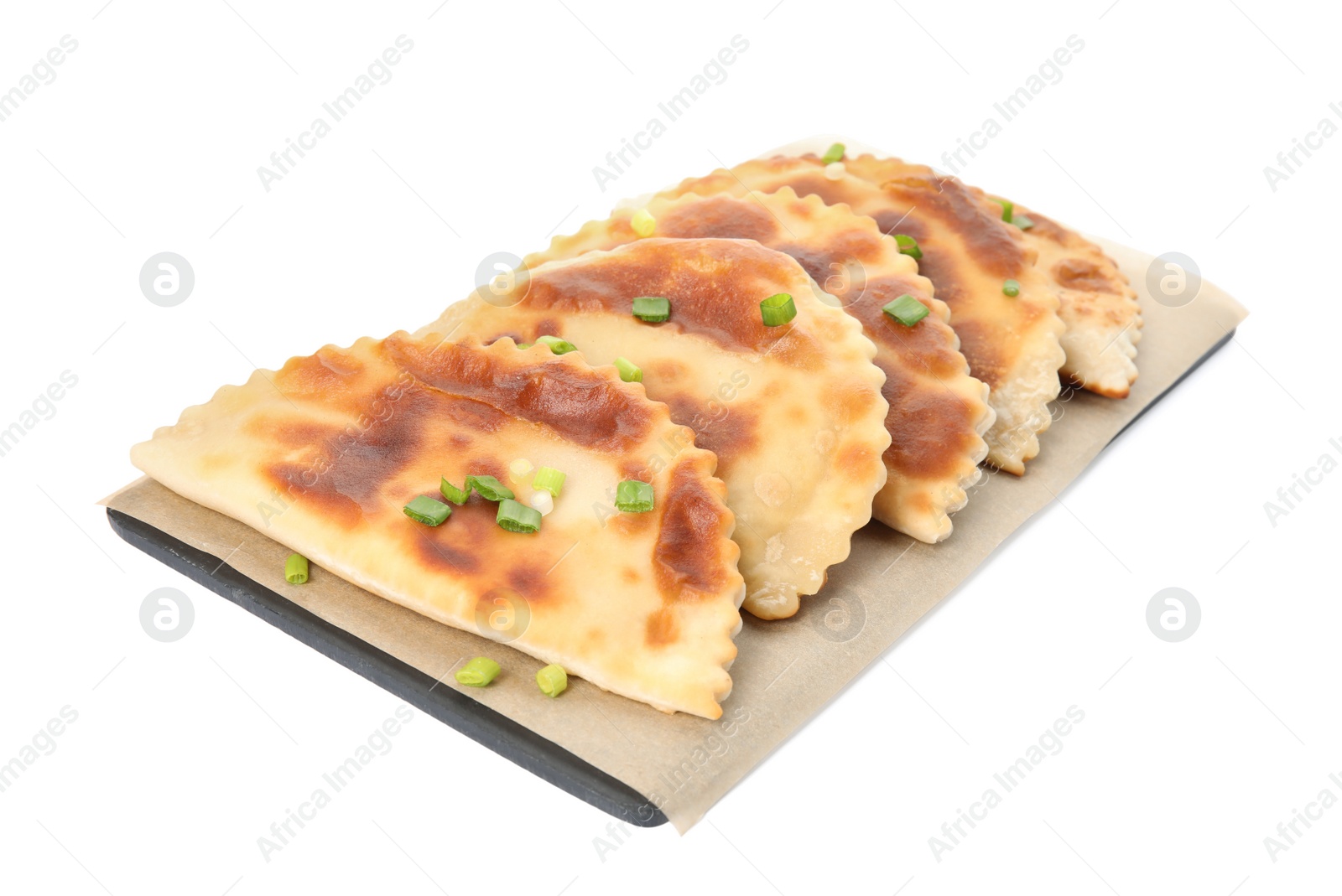 Photo of Board with delicious fried chebureki isolated on white