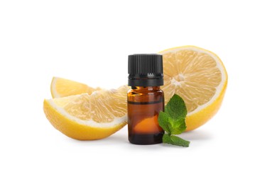 Photo of Bottle of citrus essential oil and cut fresh lemon isolated on white