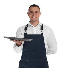 Photo of Portrait of happy young waiter with tray on white background