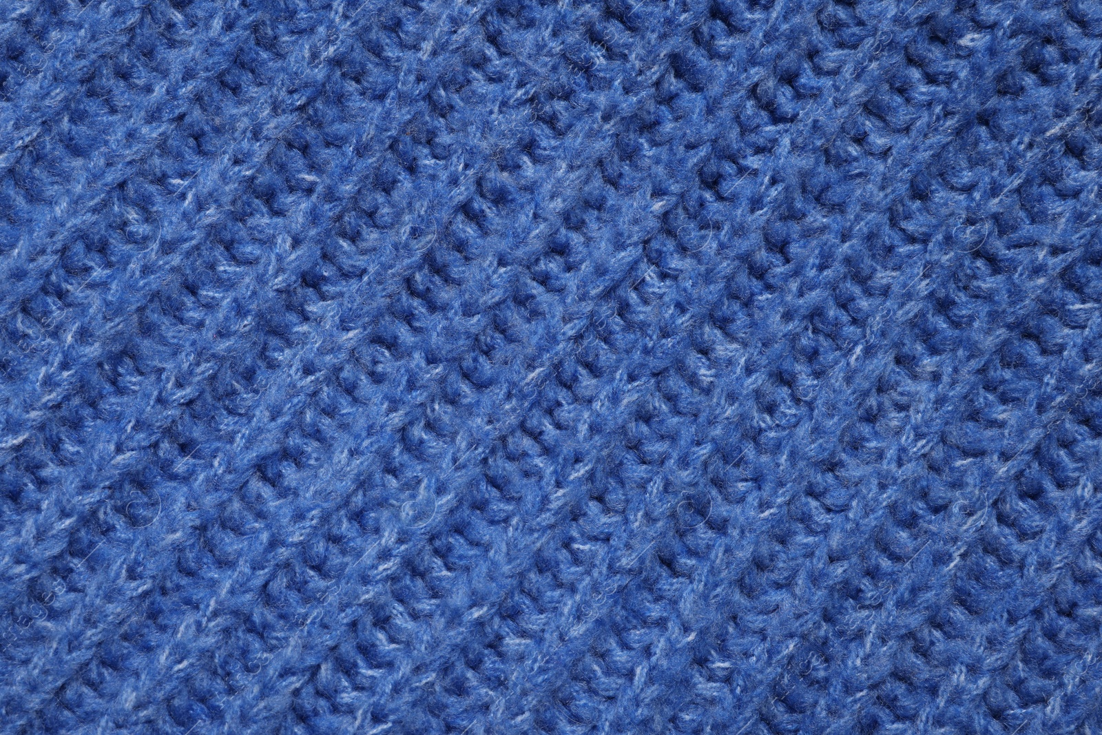 Photo of Texture of soft blue fabric as background, top view