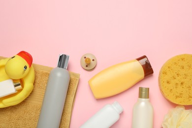 Flat lay composition with baby cosmetic products on pink background, space for text