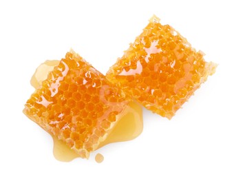 Photo of Natural honeycombs with tasty honey isolated on white, top view