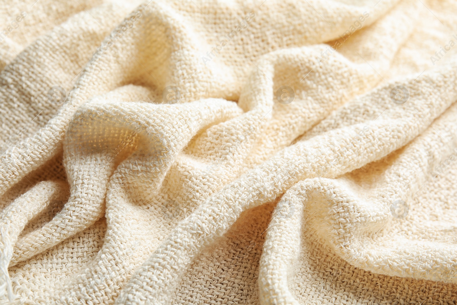 Photo of Closeup view of light natural hemp cloth. Fabric texture