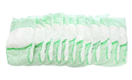 Photo of Many diapers on white background. Baby accessories
