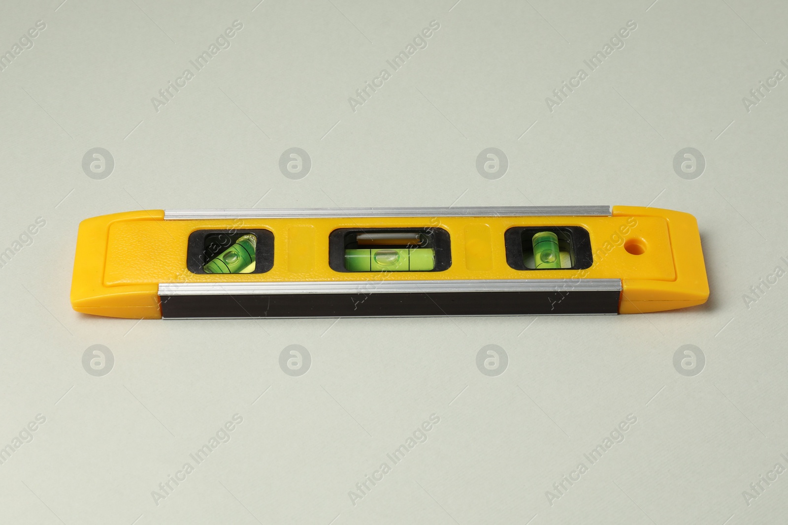 Photo of One yellow building level on beige background