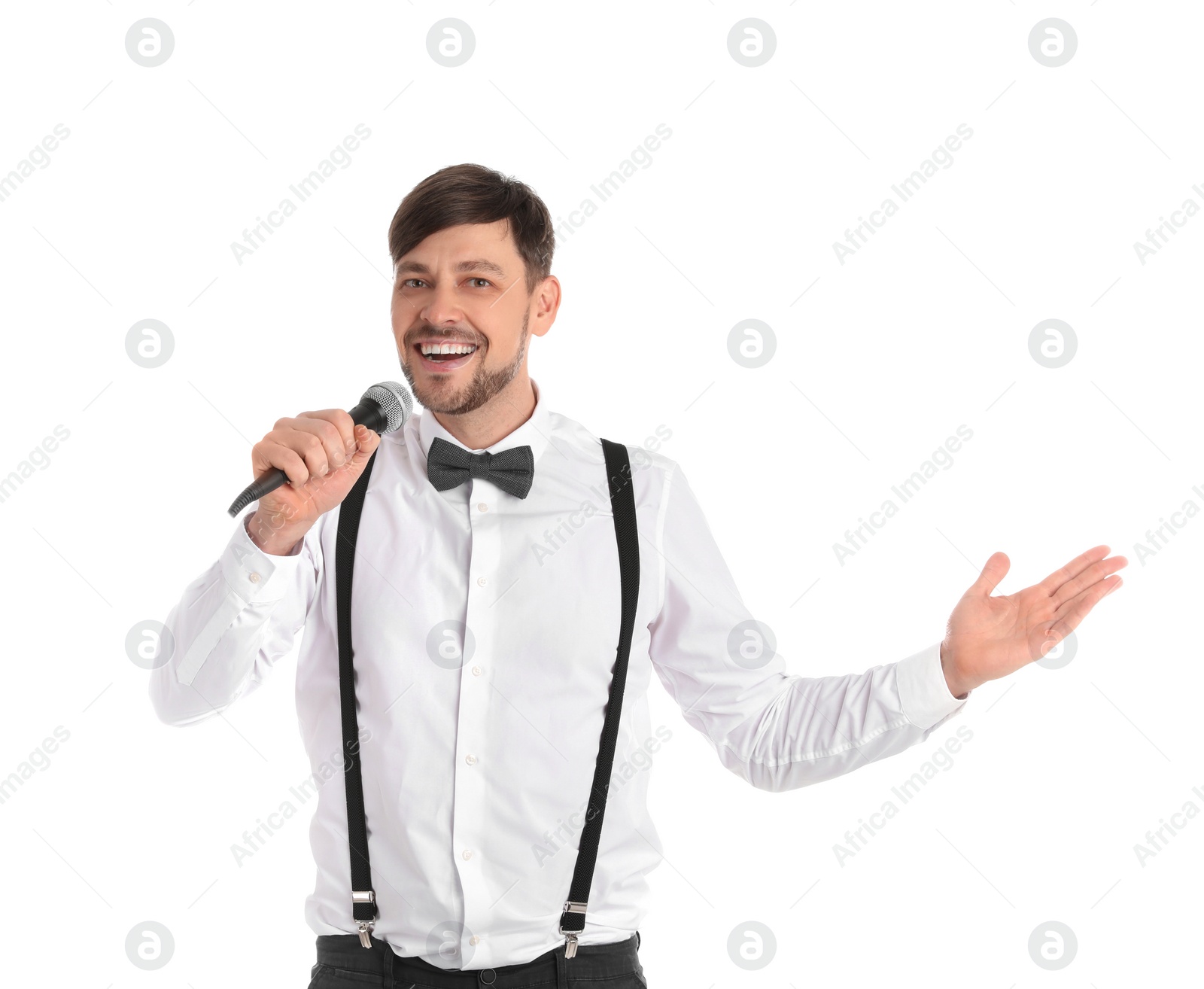 Photo of Handsome man in formal clothes posing with microphone on white background