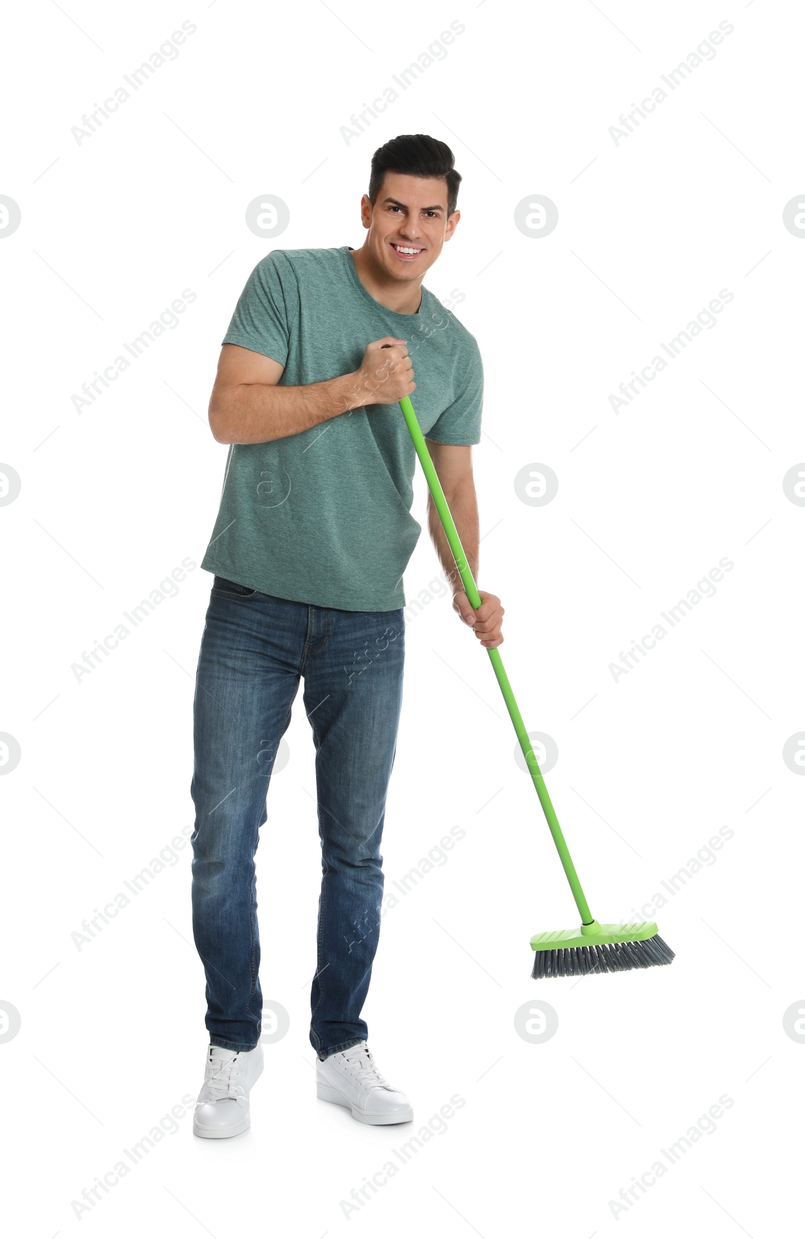 Photo of Man with green broom on white background