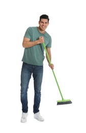 Photo of Man with green broom on white background