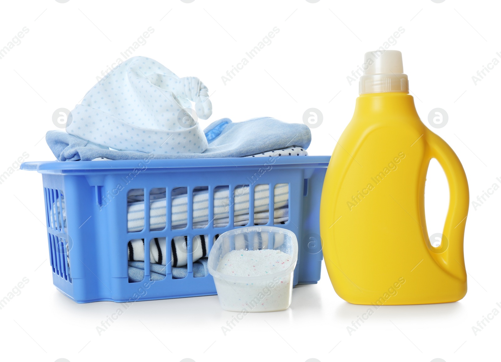 Photo of Basket with fresh baby laundry, washing powder and bottle of detergent on white background