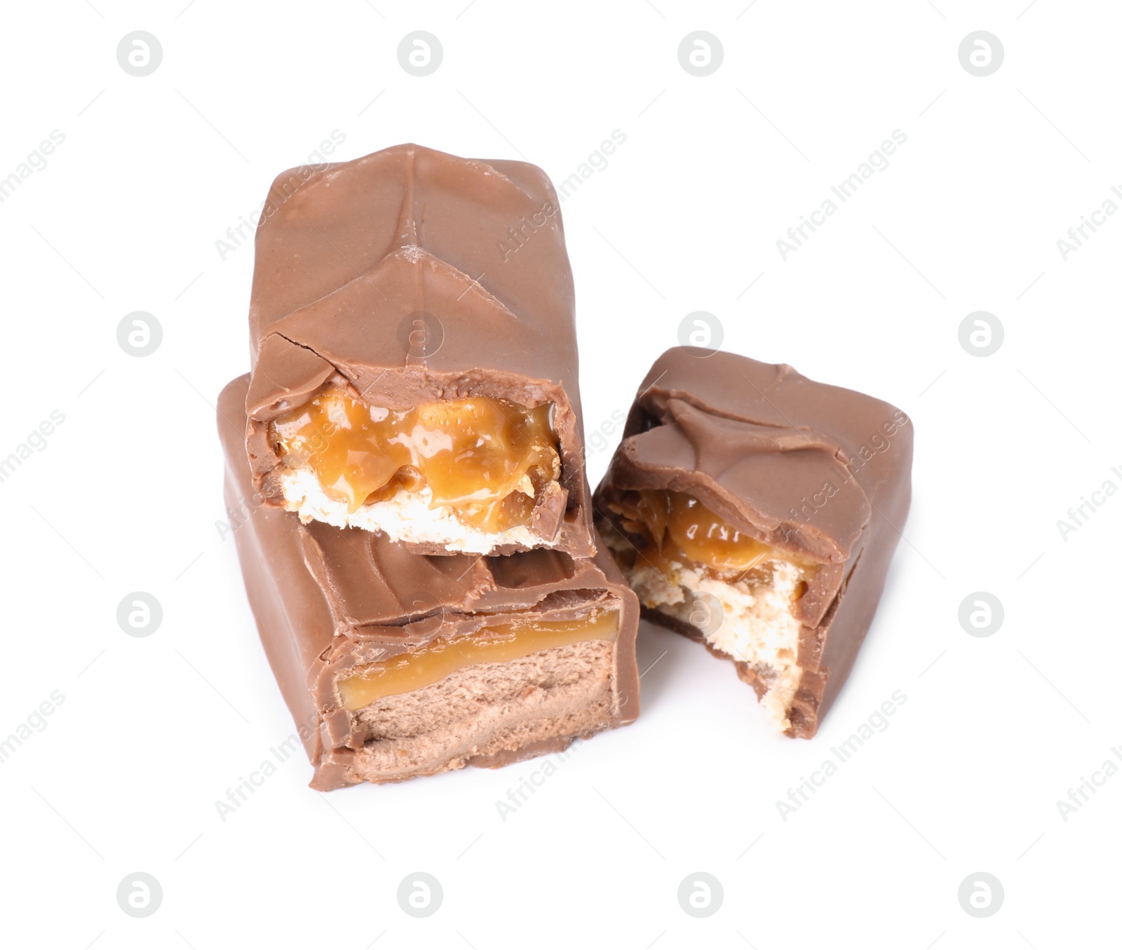 Photo of Pieces of tasty chocolate bars with nougat on white background