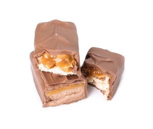 Pieces of tasty chocolate bars with nougat on white background