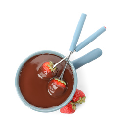 Photo of Fondue pot with chocolate and fresh strawberries isolated on white, top view