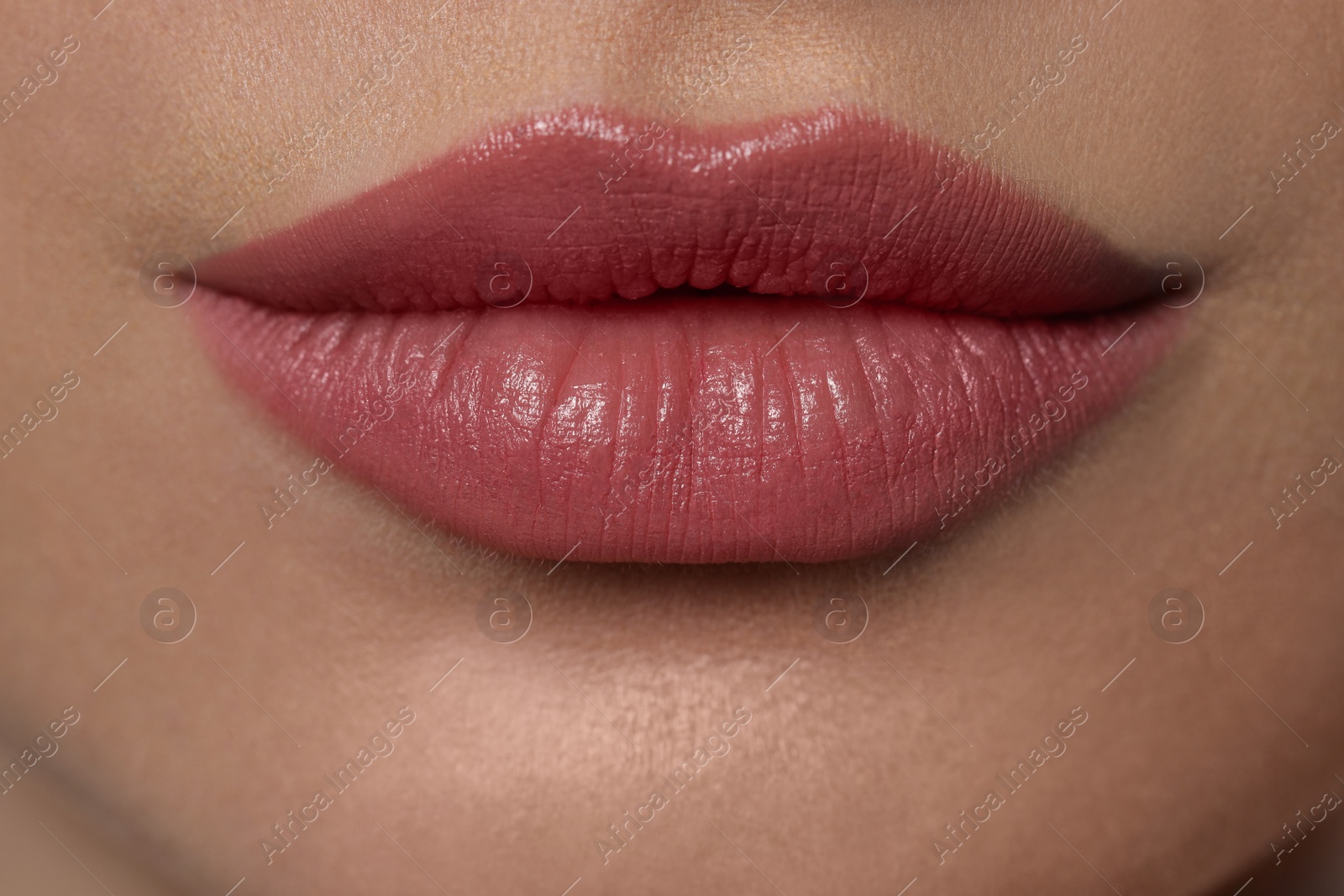 Photo of Young woman with beautiful plump lips, closeup