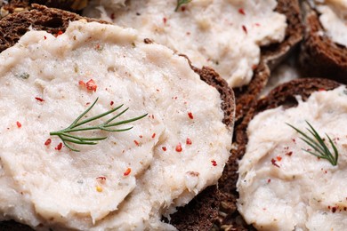 Photo of Many sandwiches with lard spread as background, closeup