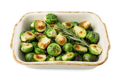 Photo of Delicious roasted Brussels sprouts and rosemary in baking dish isolated on white