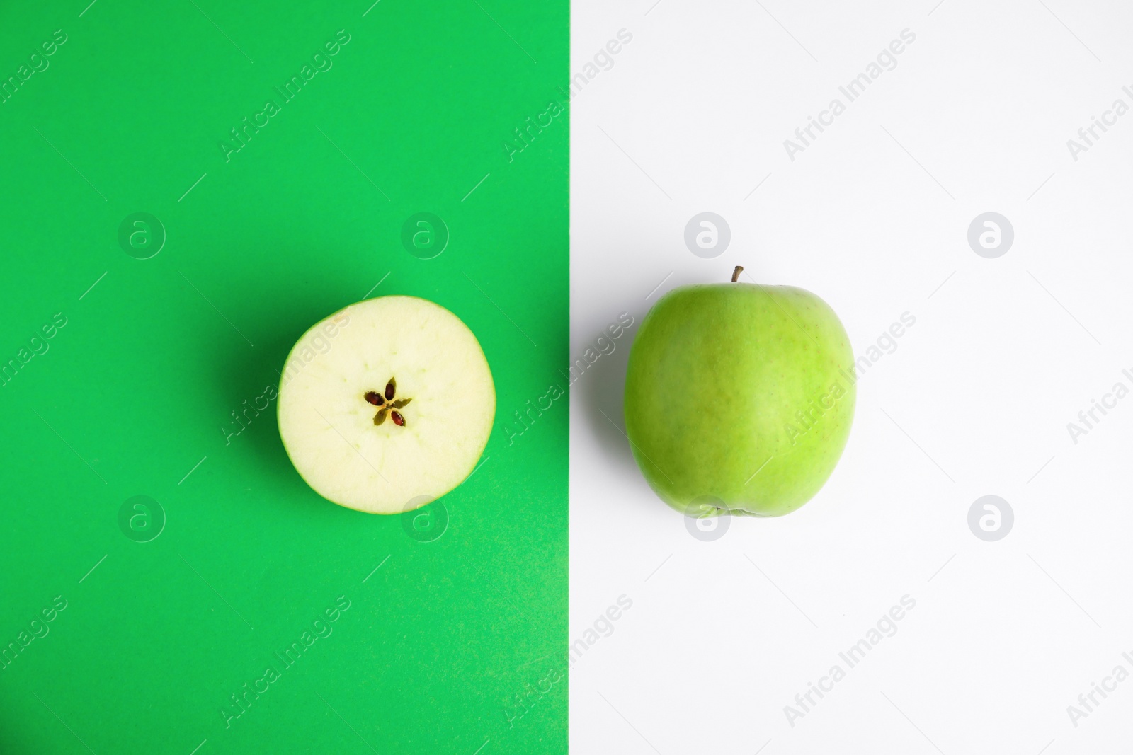 Photo of Flat lay composition of fresh ripe green apples on color background