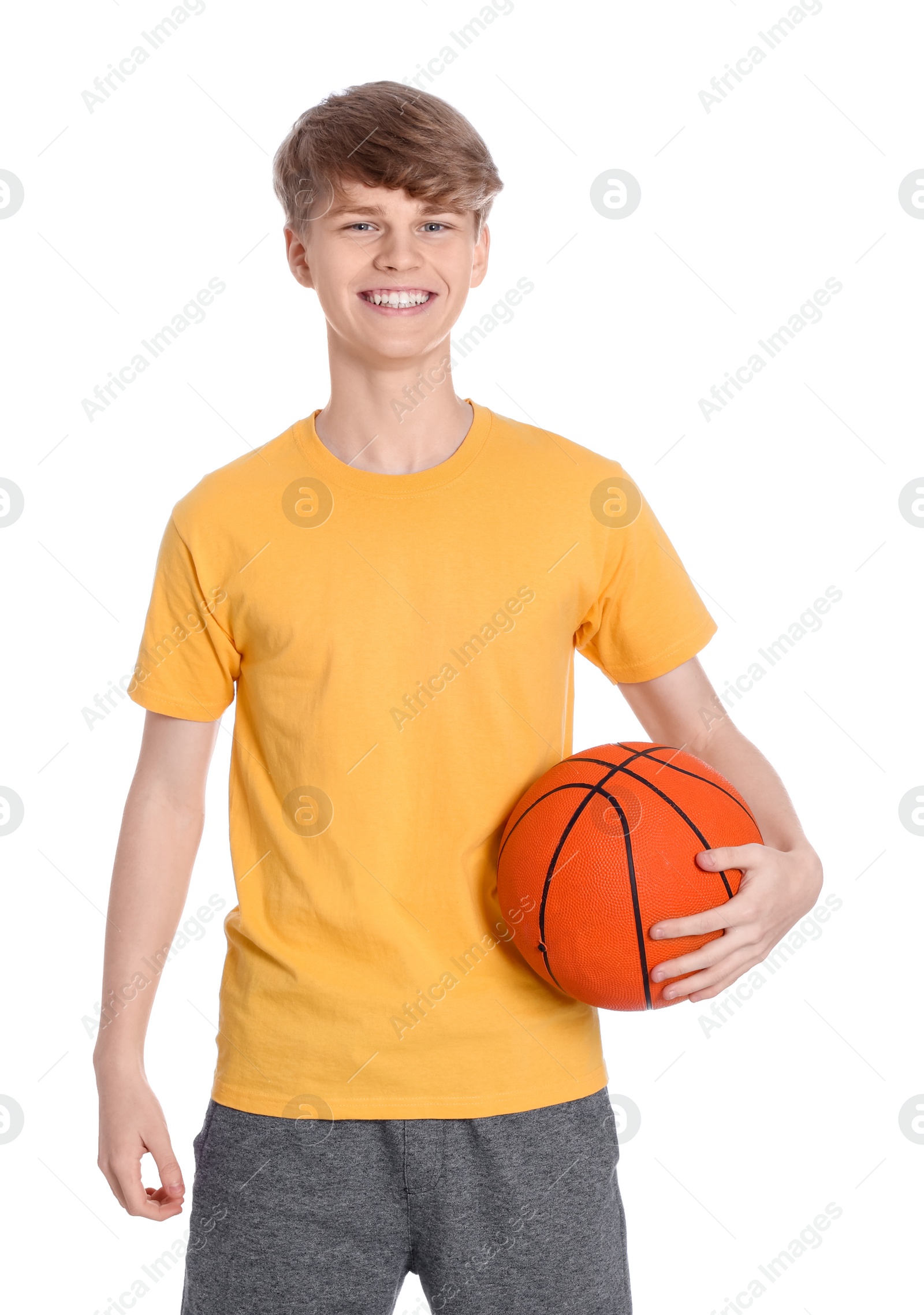 Photo of Teenage boy with basketball ball on white background