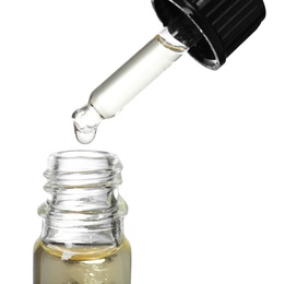 Bottle and pipette with essential oil on white background, closeup